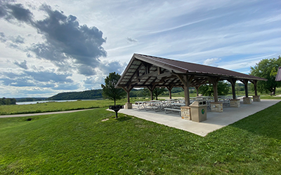 Shelter with clouds in the sky and lake in the background